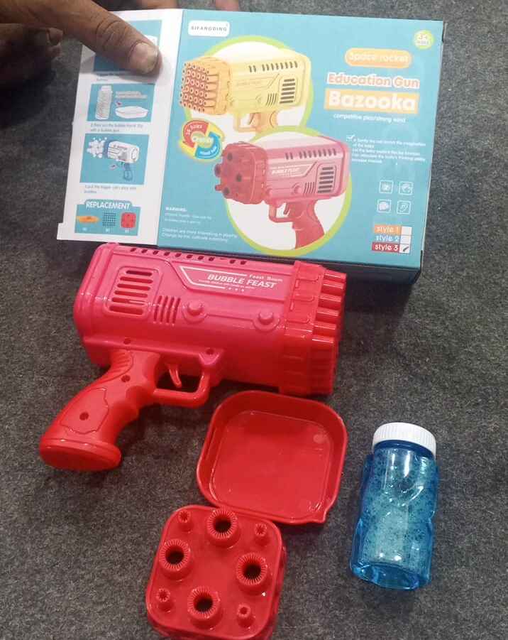 colorful bazooka bubble gun toy creating bubbles for outdoor play