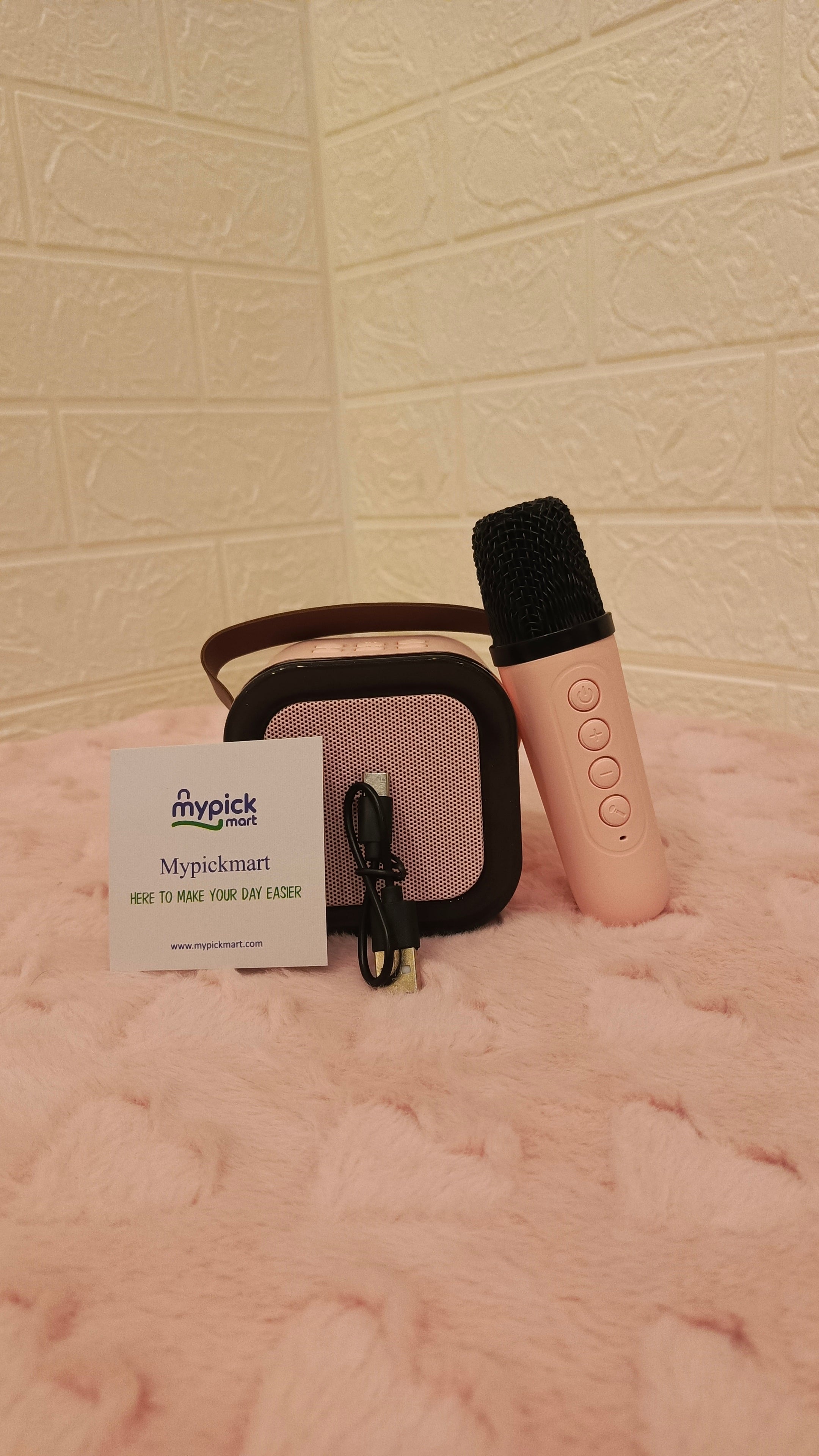 Pink handheld device with microphone on a textured pink surface WIRELESS MIC FOR KIDS , MYPICKMART