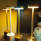 Set of LED table lamps on a dark surface with a blurred background