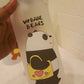 Bottle with cartoon panda design and 'WEBABE BEARS' text on a light background