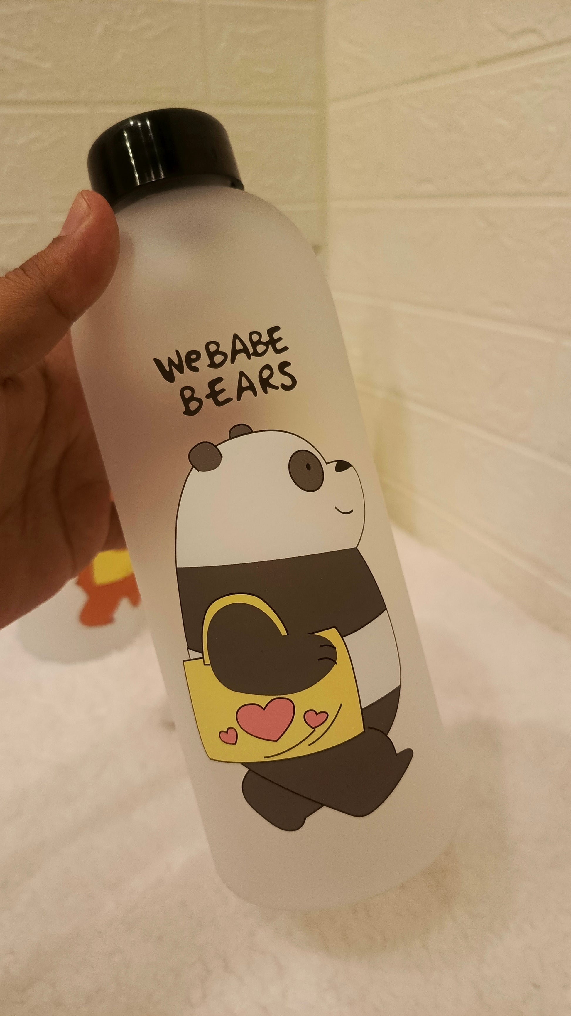 Bottle with cartoon panda design and 'WEBABE BEARS' text on a light background